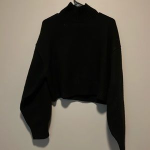 Black semi turtle neck sweater.